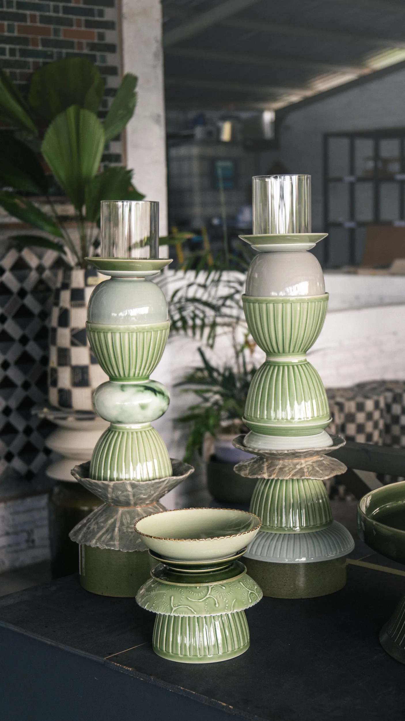 Green ridged ceramic candle holders with glass hurricane tops